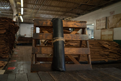 Black Latigo Leather from Hermann Oak Leather Co rolled and tied with twine