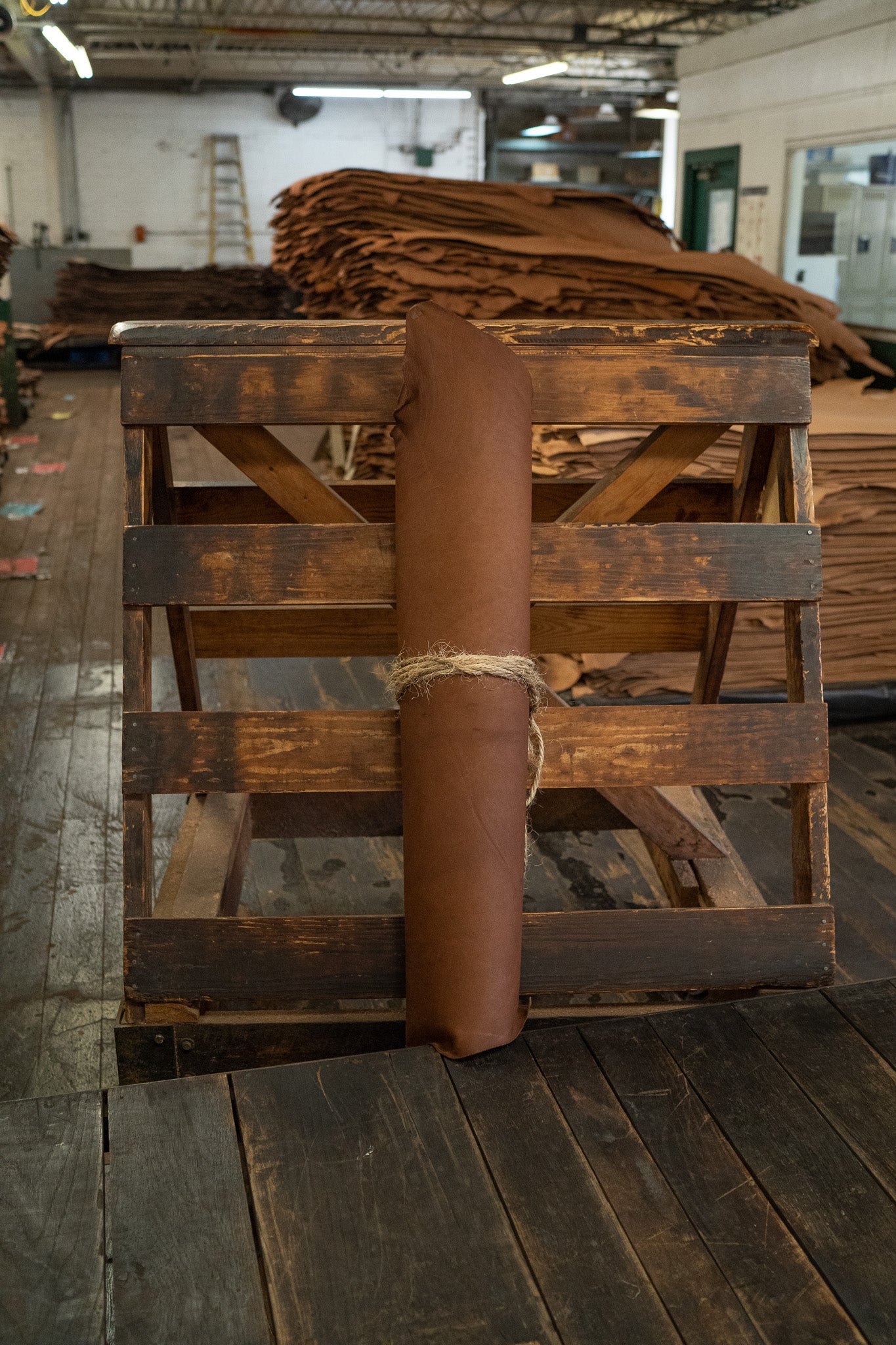 Chocolate Expedition Leather from Hermann Oak Leather Co rolled and tied with twine