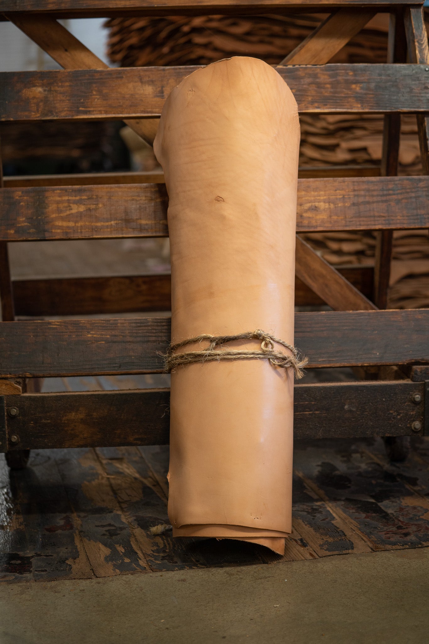 Natural Skirting Leather from Hermann Oak Leather Co rolled and tied with twine