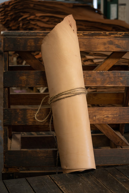 Natural Tooling Leather from Hermann Oak Leather Co rolled and tied with twine