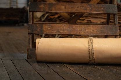 Natural Tooling Leather from Hermann Oak Leather Co rolled and tied with twine